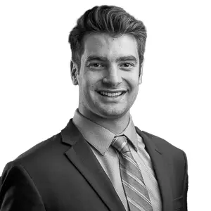 Professional studio headshot of Jez Lawson, Co-Founder of First Fridays CRE.