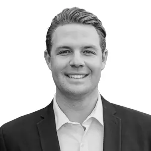 Professional studio headshot of Jake DuCharme, Director of Philanthropy at First Fridays CRE.